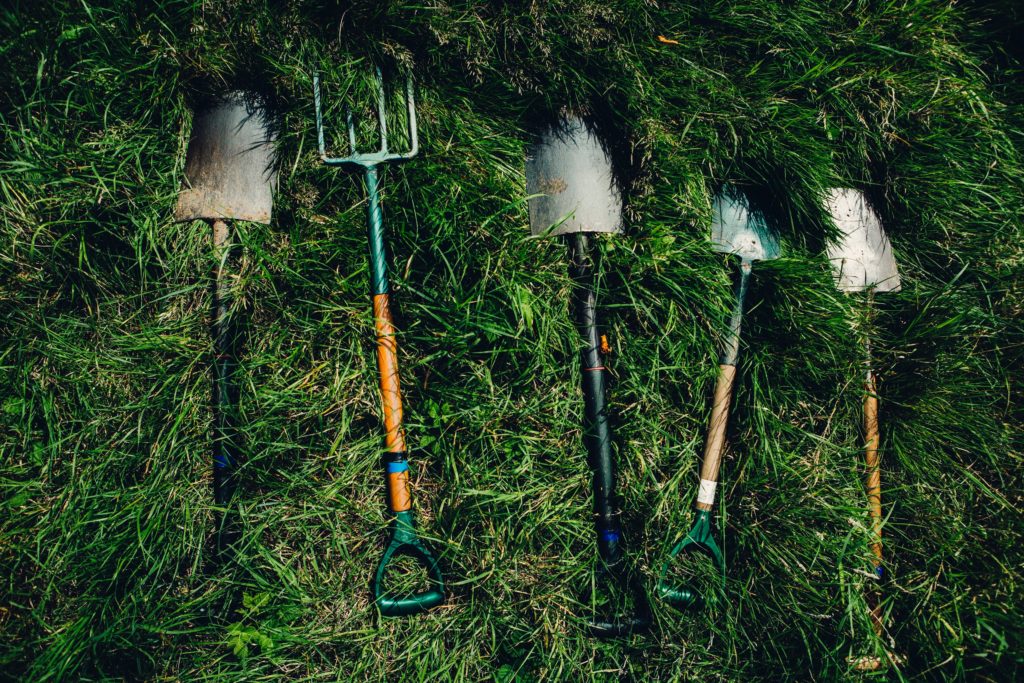 Photo of pitchfork and shovels to represent Richard Brautigan's creative book titles for literary analysis