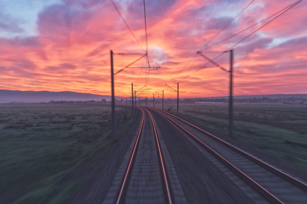 Photo of train tracks and light on Notes of Oak Literary Blog